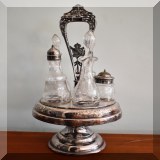 S102. Silverplate condiment or cruet set with etched glass bottles. 17”h - $40 